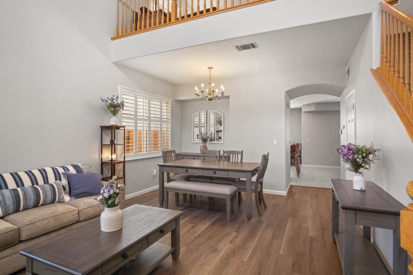 3021 Simms Lane Tracy, CA 95377 - Photo 4 of 33 a living room with furniture a wooden floor and a chandelier