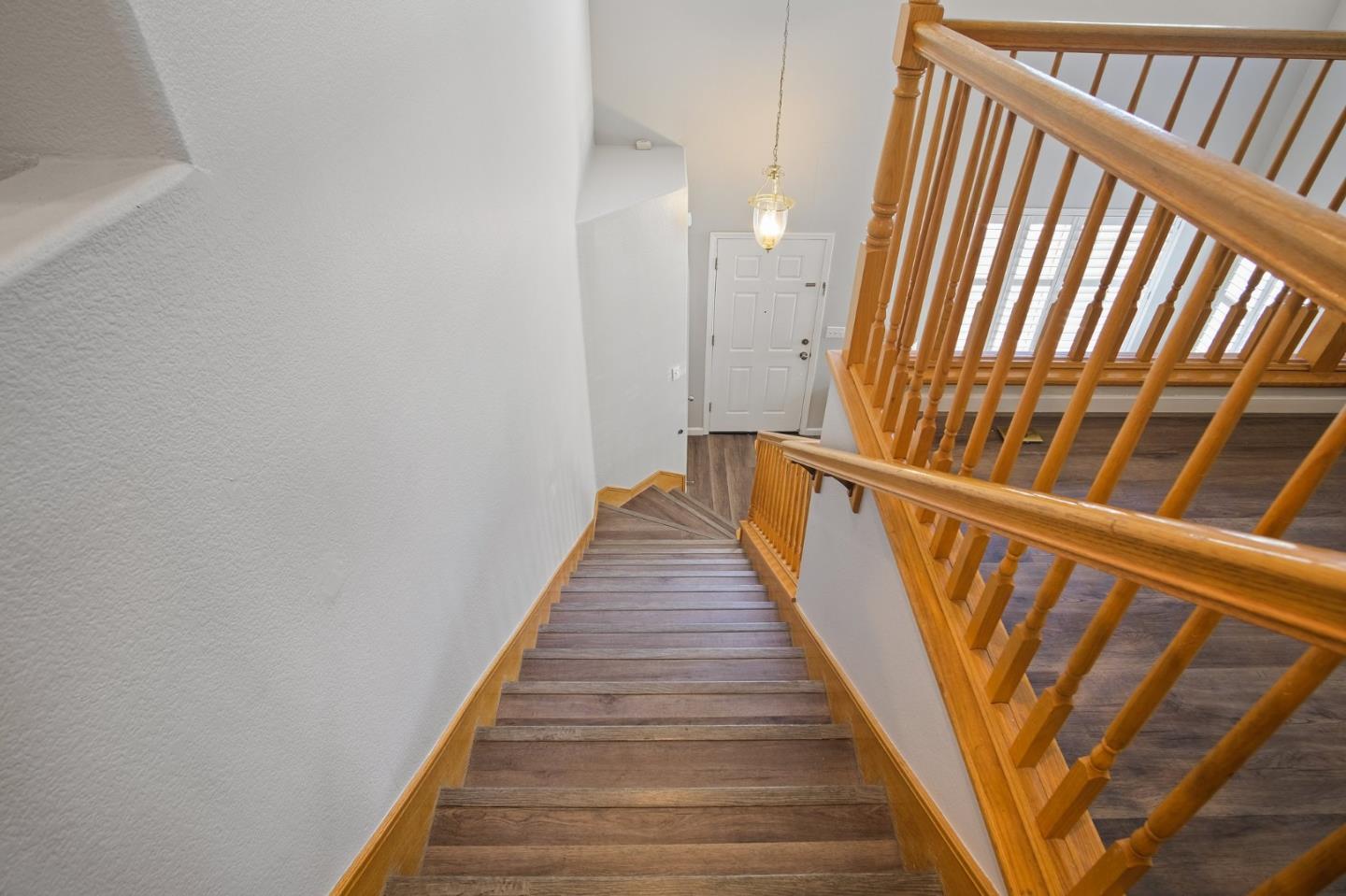 3021 Simms Lane Tracy, CA 95377 - Photo 7 of 33 a view of staircase with wooden floor and white walls