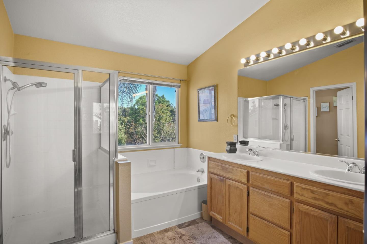 3021 Simms Lane Tracy, CA 95377 - Photo 10 of 33 a bathroom with a tub sink and mirror