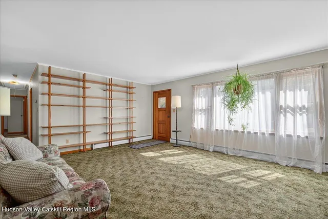 a view of livingroom with furniture and window