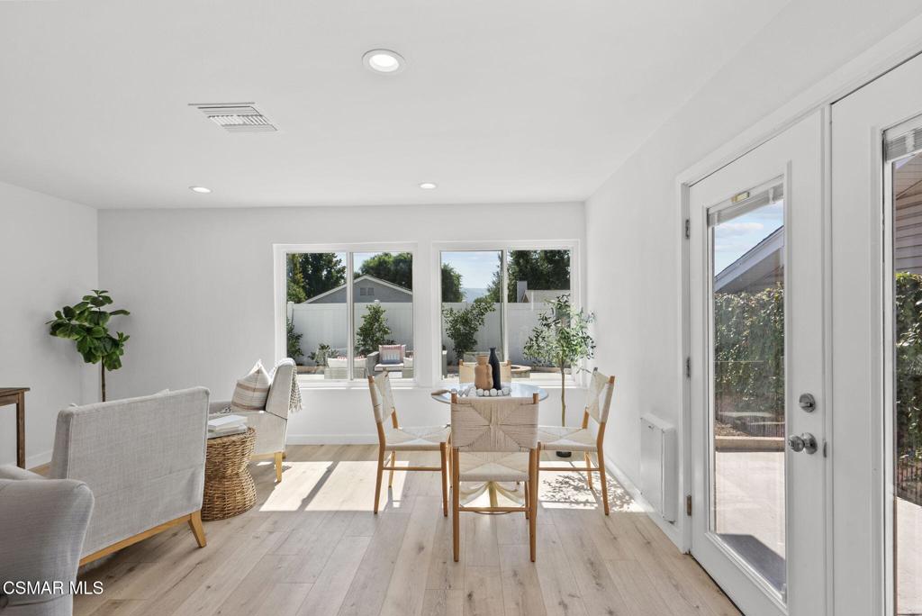 1882 Larch Street Simi Valley, CA 93065 - Photo 12 of 34 a view of a dining room with furniture and wooden floor