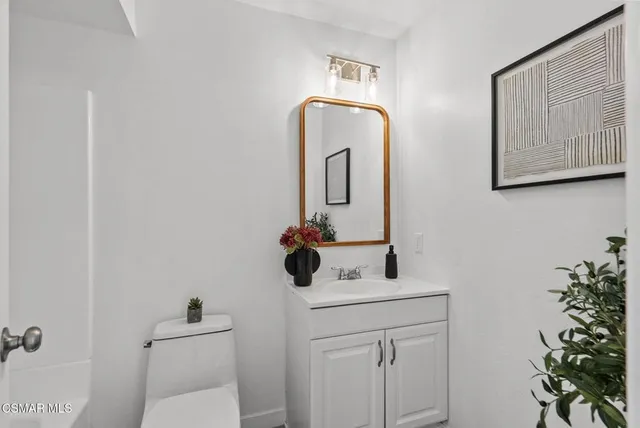 a bathroom with a toilet a sink and bathtub
