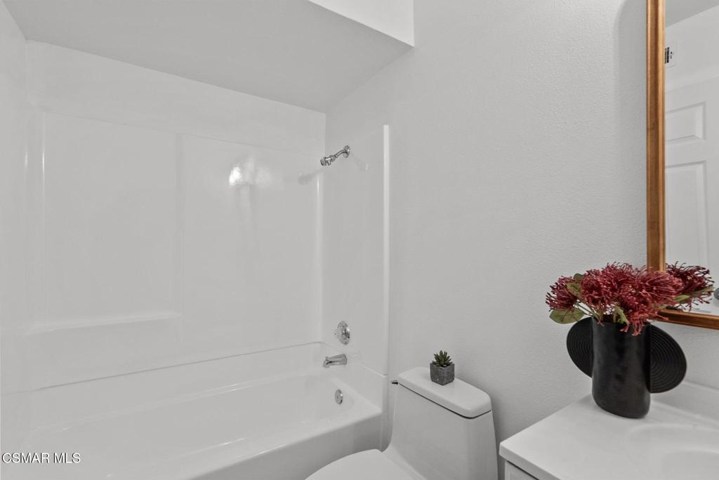 1882 Larch Street Simi Valley, CA 93065 - Photo 18 of 34 a bathroom with a toilet a sink and bathtub