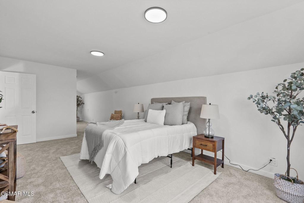 1882 Larch Street Simi Valley, CA 93065 - Photo 22 of 34 a bedroom with bed and a potted plant