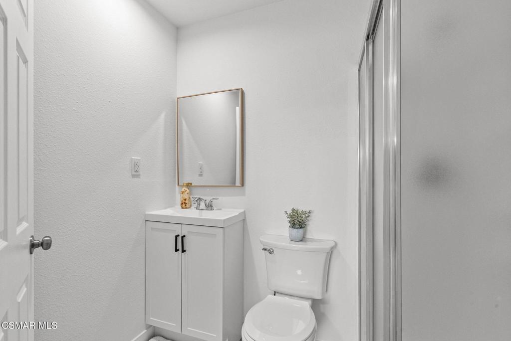 1882 Larch Street Simi Valley, CA 93065 - Photo 26 of 34 a bathroom with a toilet sink and mirror