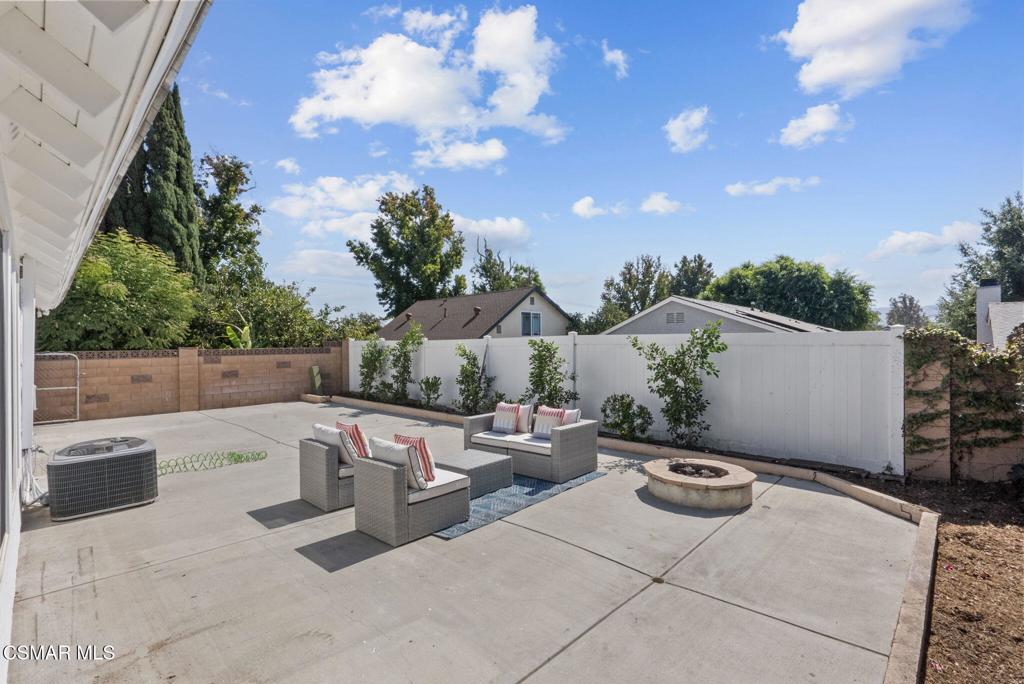 1882 Larch Street Simi Valley, CA 93065 - Photo 27 of 34 a roof deck with table and chairs and potted plants