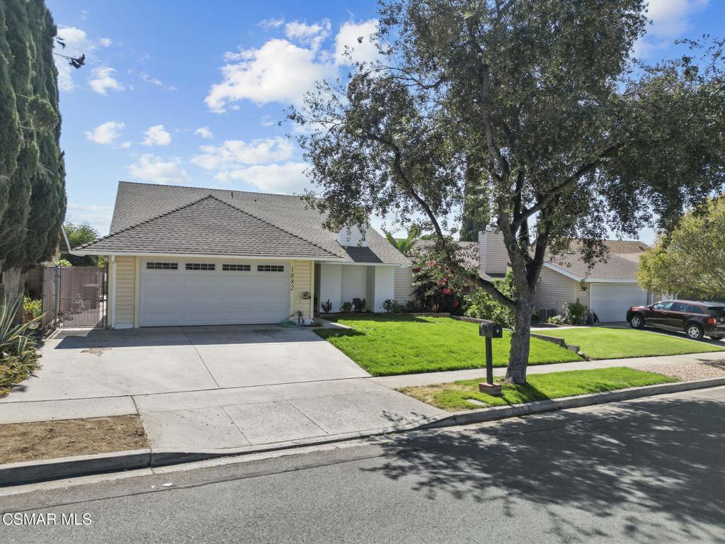 1882 Larch Street Simi Valley, CA 93065 - Photo 32 of 34 a front view of a house with a yard and garage