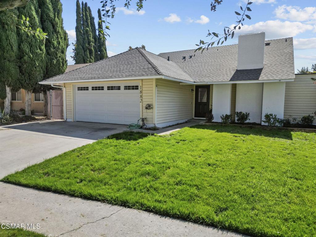 1882 Larch Street Simi Valley, CA 93065 - Photo 34 of 34 a front view of a house with a yard and garage