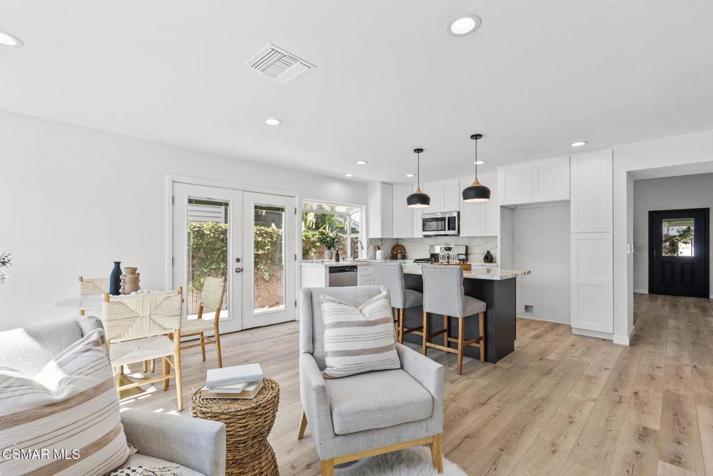 1882 Larch Street Simi Valley, CA 93065 - Photo 8 of 34 a living room with furniture white walls and kitchen view