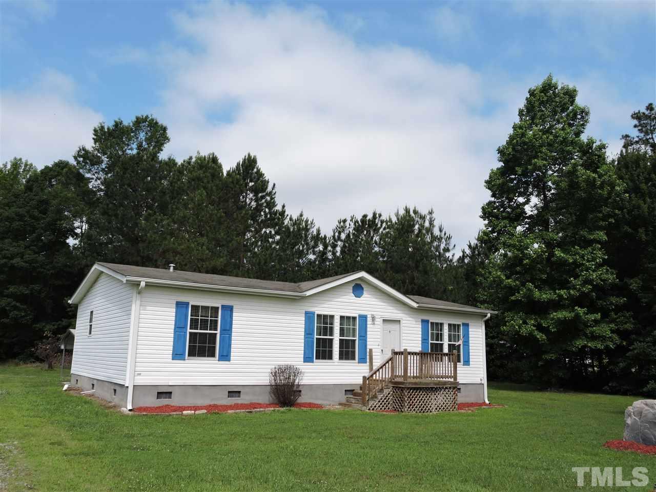 320 Moriah Road Rougemont, NC 27572 - Photo 1 of 16 a front view of house with yard and green space