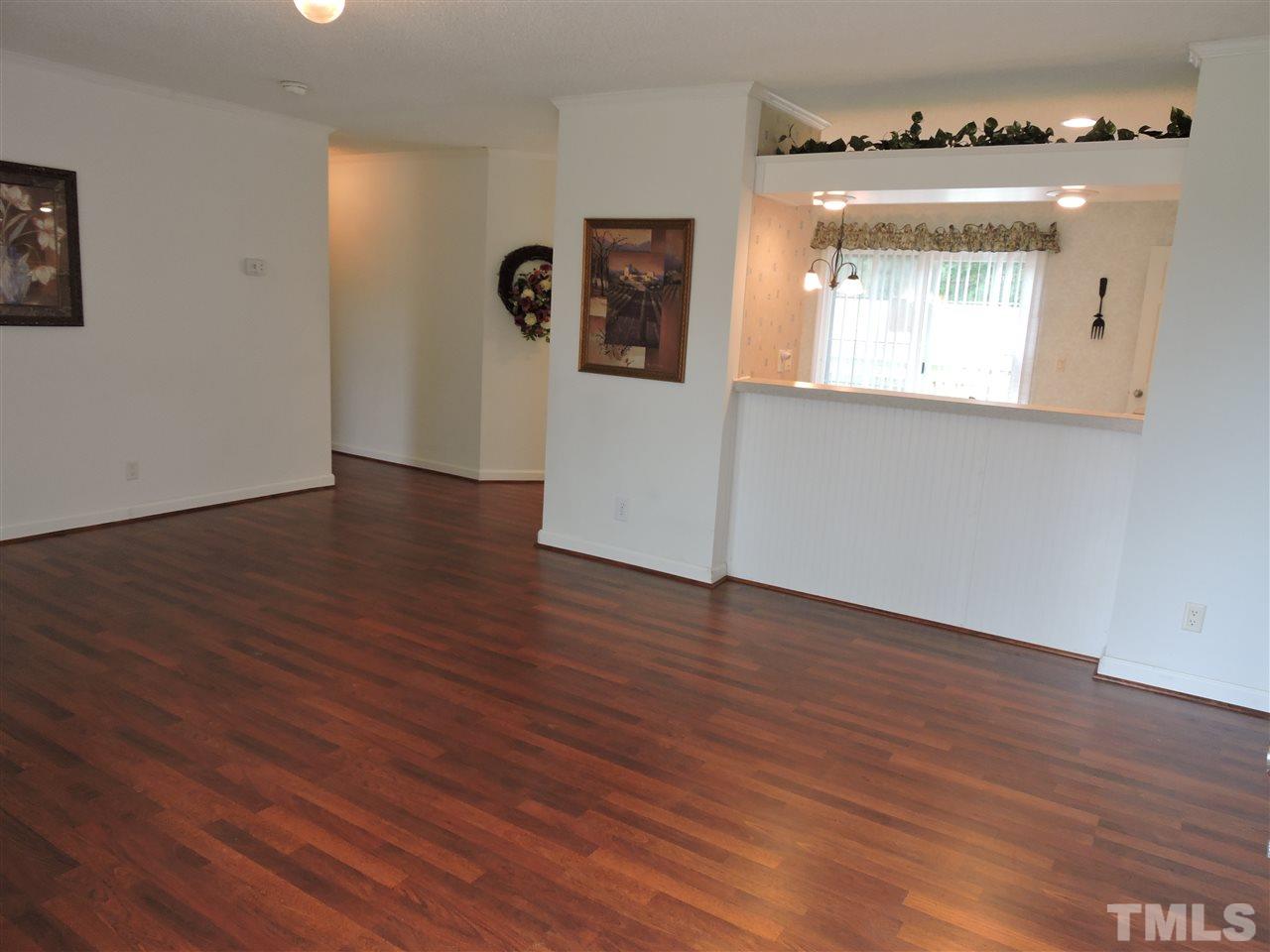 320 Moriah Road Rougemont, NC 27572 - Photo 2 of 16 an empty room with wooden floor and windows