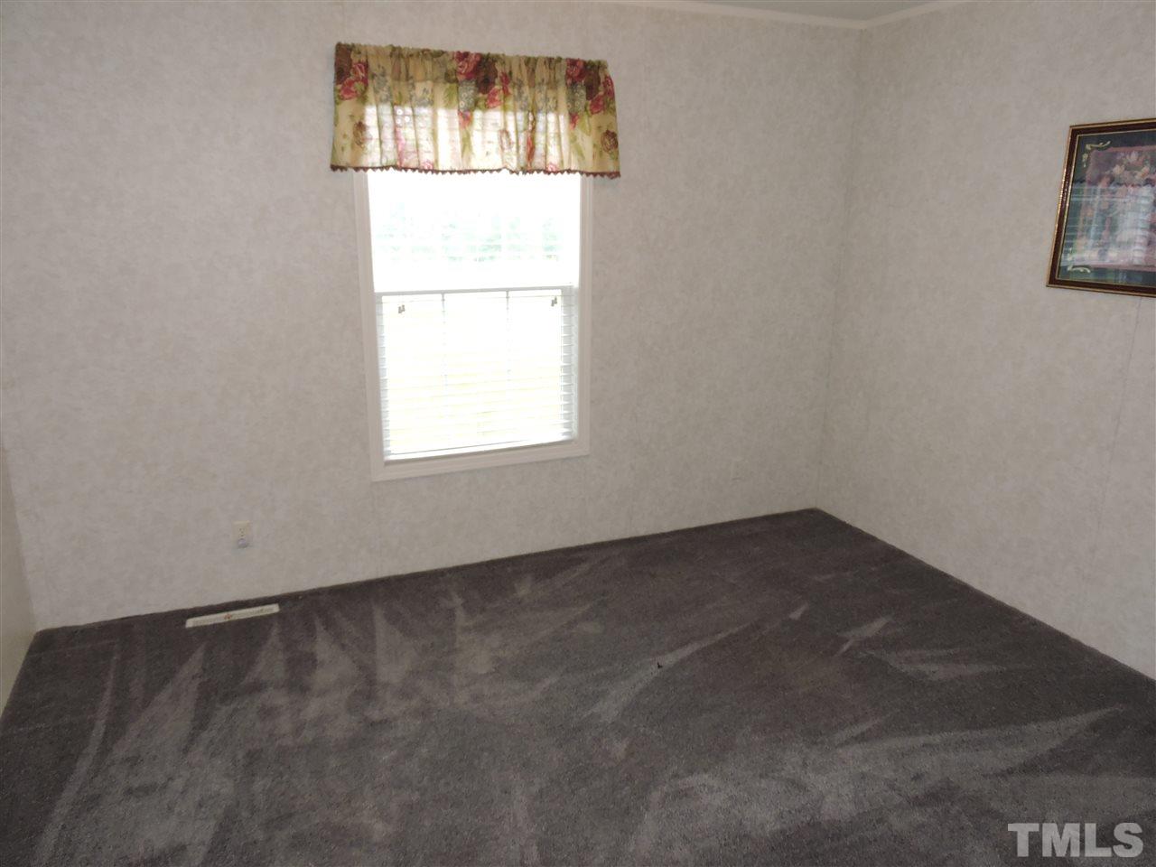 320 Moriah Road Rougemont, NC 27572 - Photo 11 of 16 an empty room with a window