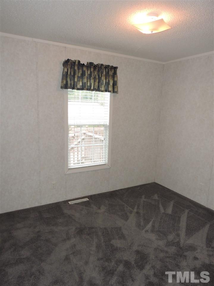 320 Moriah Road Rougemont, NC 27572 - Photo 12 of 16 an empty room with a window