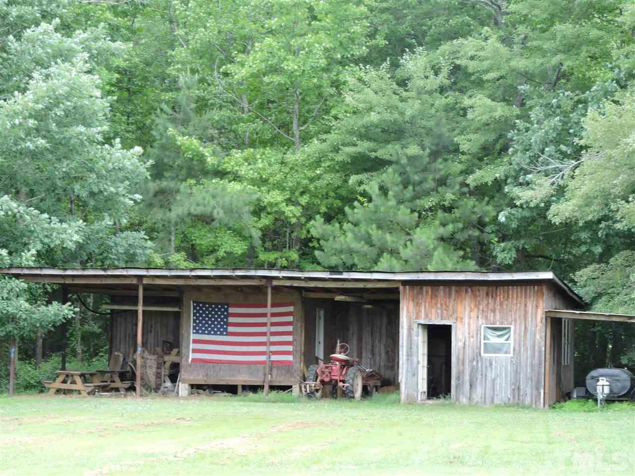 320 Moriah Road Rougemont, NC 27572 - Photo 15 of 16 a backyard of a house with barbeque oven table and chairs
