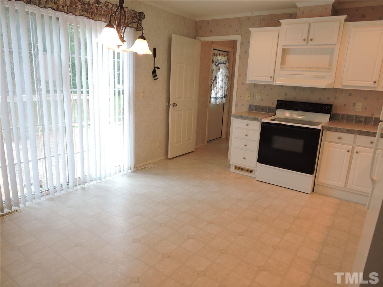 320 Moriah Road Rougemont, NC 27572 - Photo 7 of 16 a view of a kitchen with a sink and a stove top oven