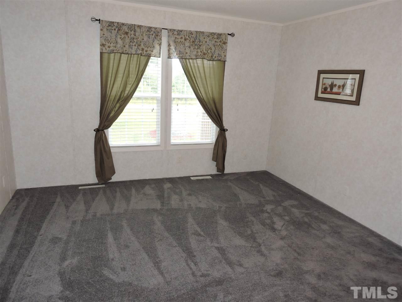 320 Moriah Road Rougemont, NC 27572 - Photo 9 of 16 an empty room with a window