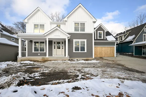 a view of a white house with a large windows