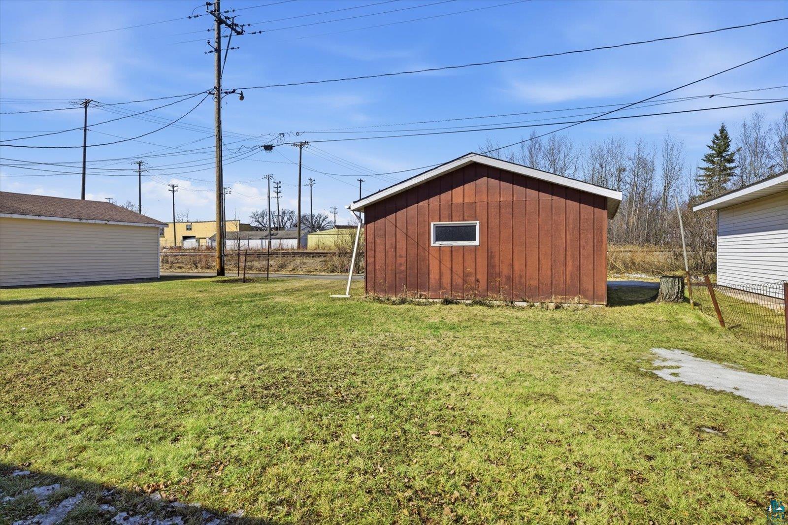 709 Michigan Street Hibbing, MN 55746 - Photo 23 of 47 View of yard with a storage unit
