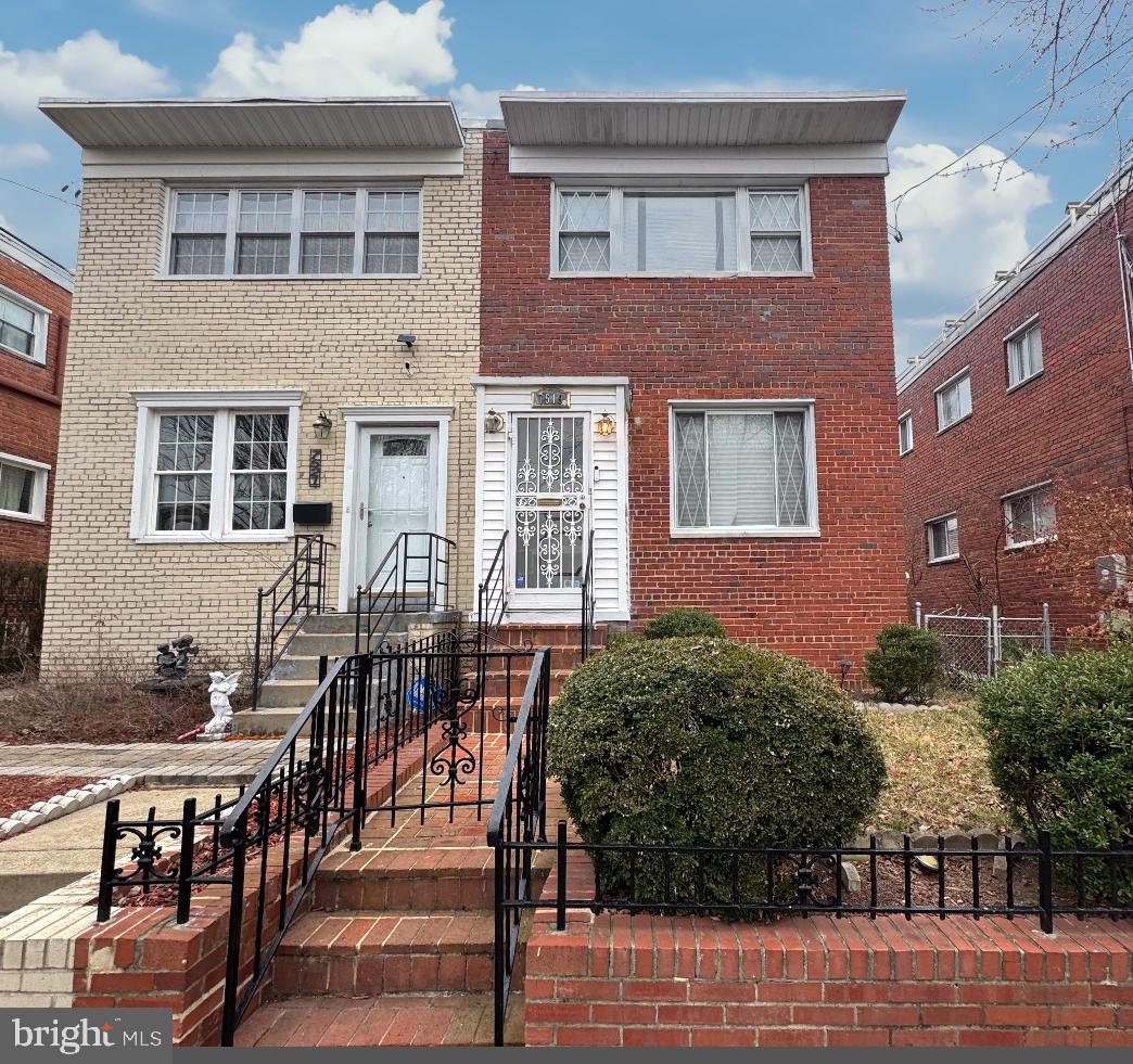 7519 8th Street Northwest Washington, DC 20012 - Photo 1 of 19 a view of a brick house with many windows