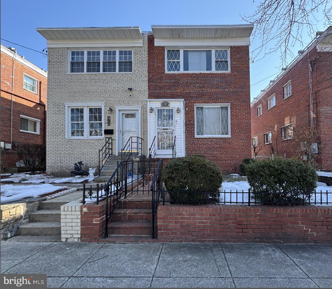 7519 8th Street Northwest Washington, DC 20012 - Photo 19 of 19 a view of a brick house with many windows