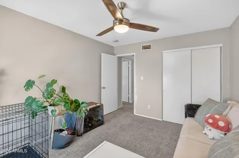 a bathroom with a sink vanity mirror and toilet
