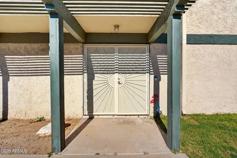 a living room with furniture a flat screen tv and a large window