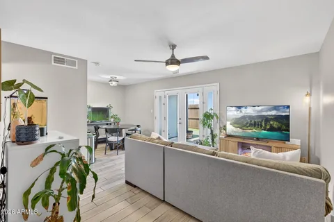 a living room with furniture and a flat screen tv
