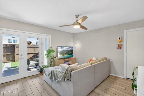 a living room with furniture and a potted plant