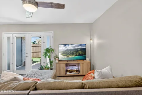 a living room with furniture and kitchen view