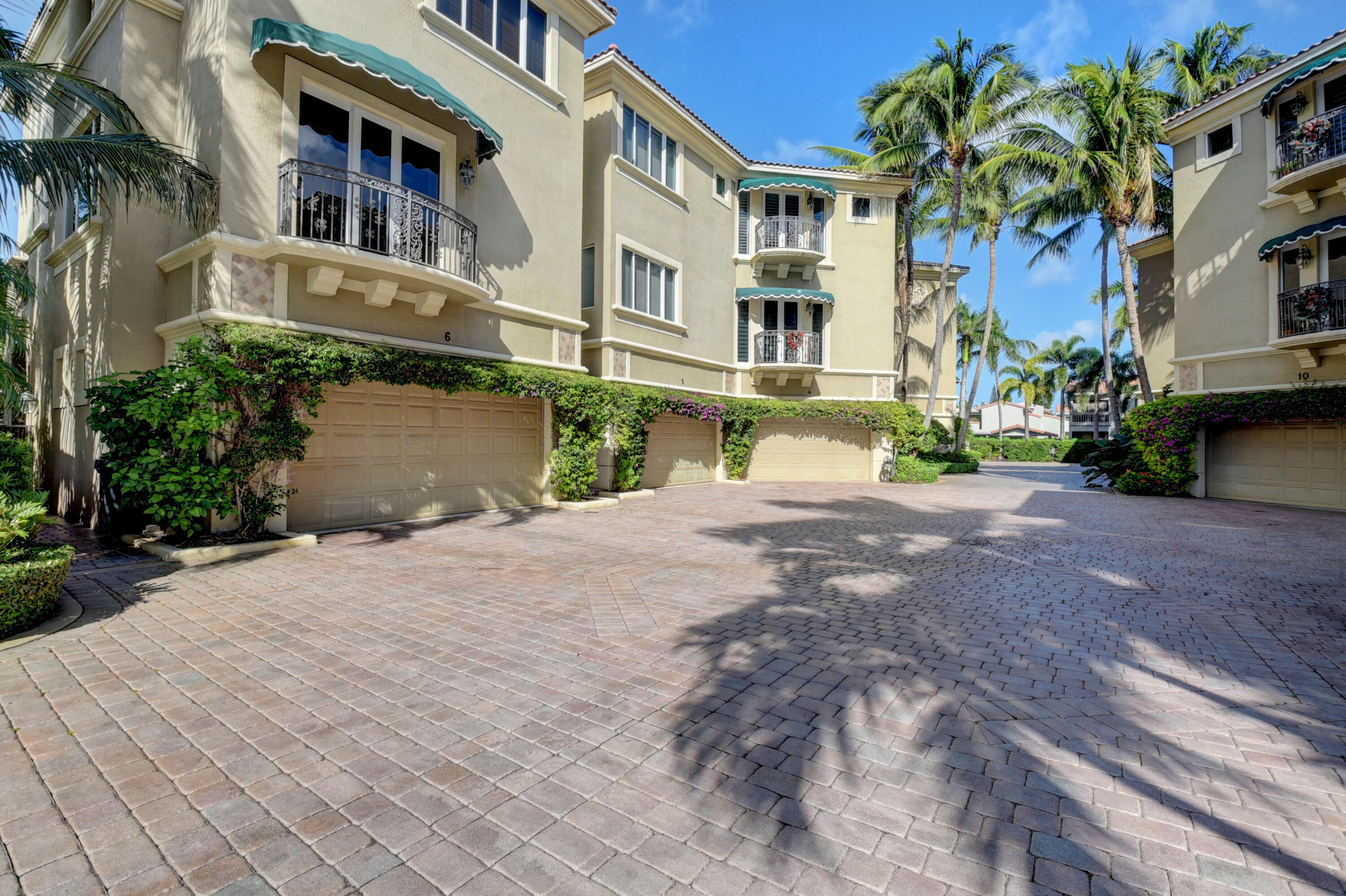 921 Osceola Drive, Unit 4 Boca Raton, FL 33432 - Photo 1 of 46 a front view of a house with a yard