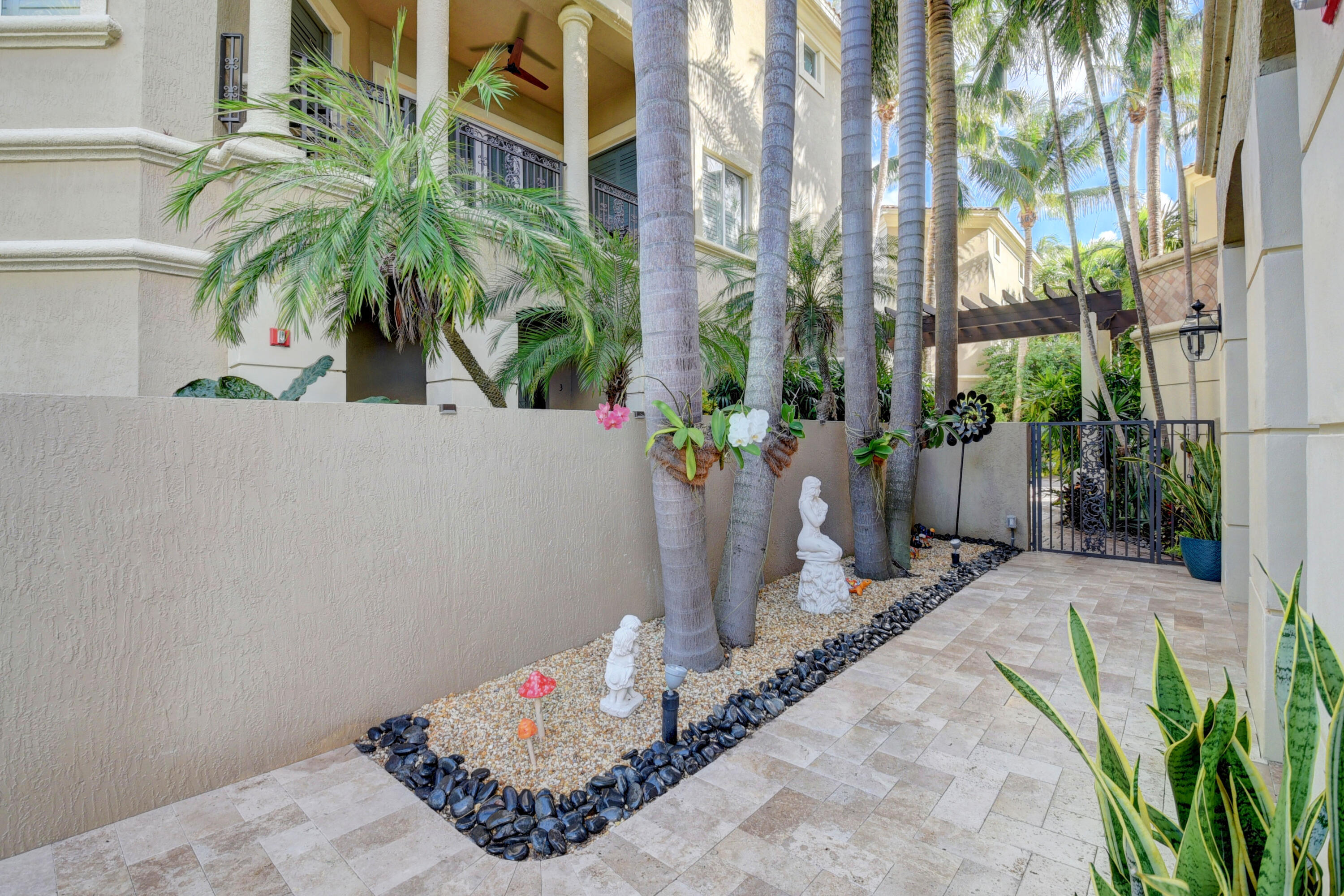 921 Osceola Drive, Unit 4 Boca Raton, FL 33432 - Photo 11 of 46 a potted plants sitting in front of a house