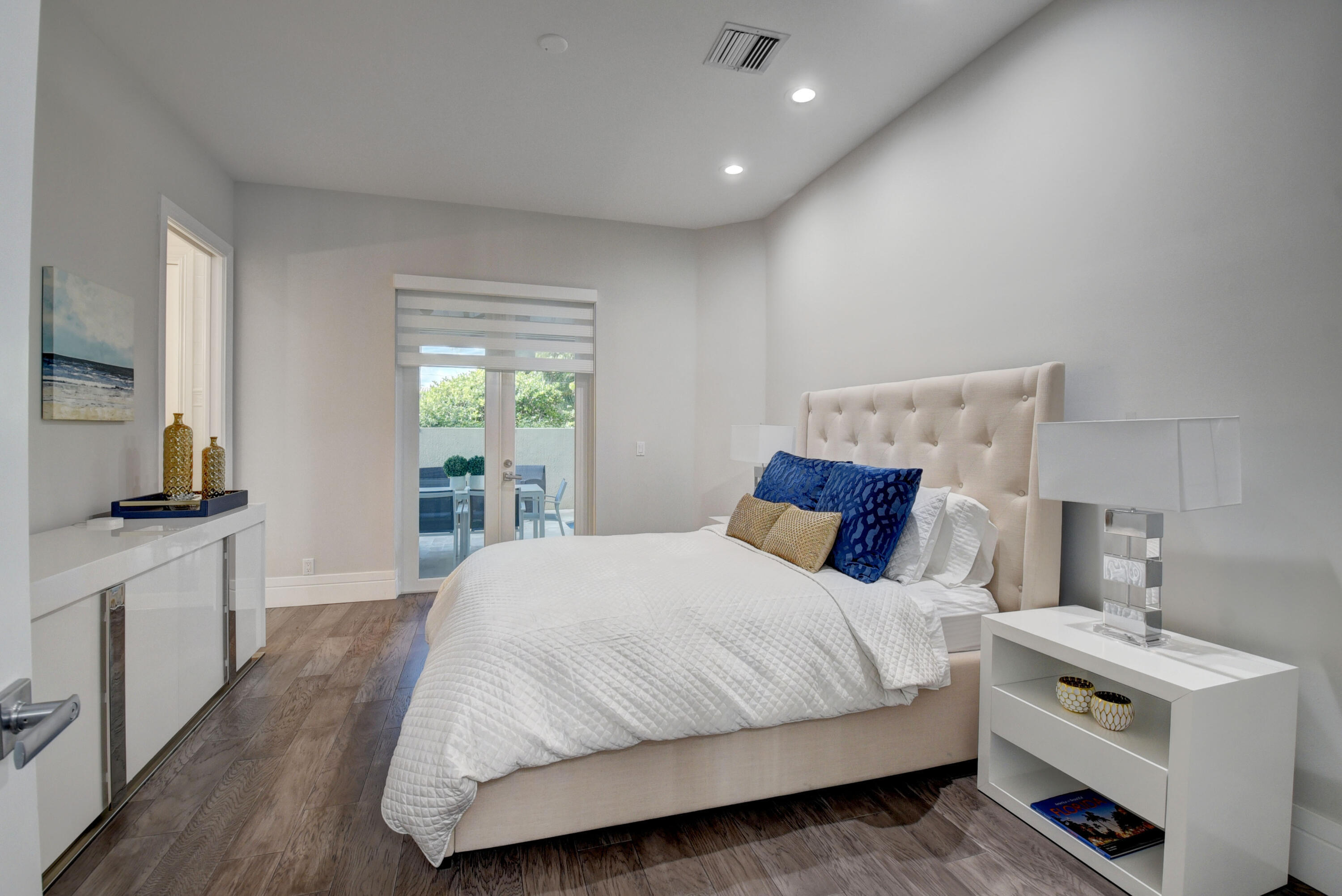 921 Osceola Drive, Unit 4 Boca Raton, FL 33432 - Photo 15 of 46 a bedroom with a bed and a window