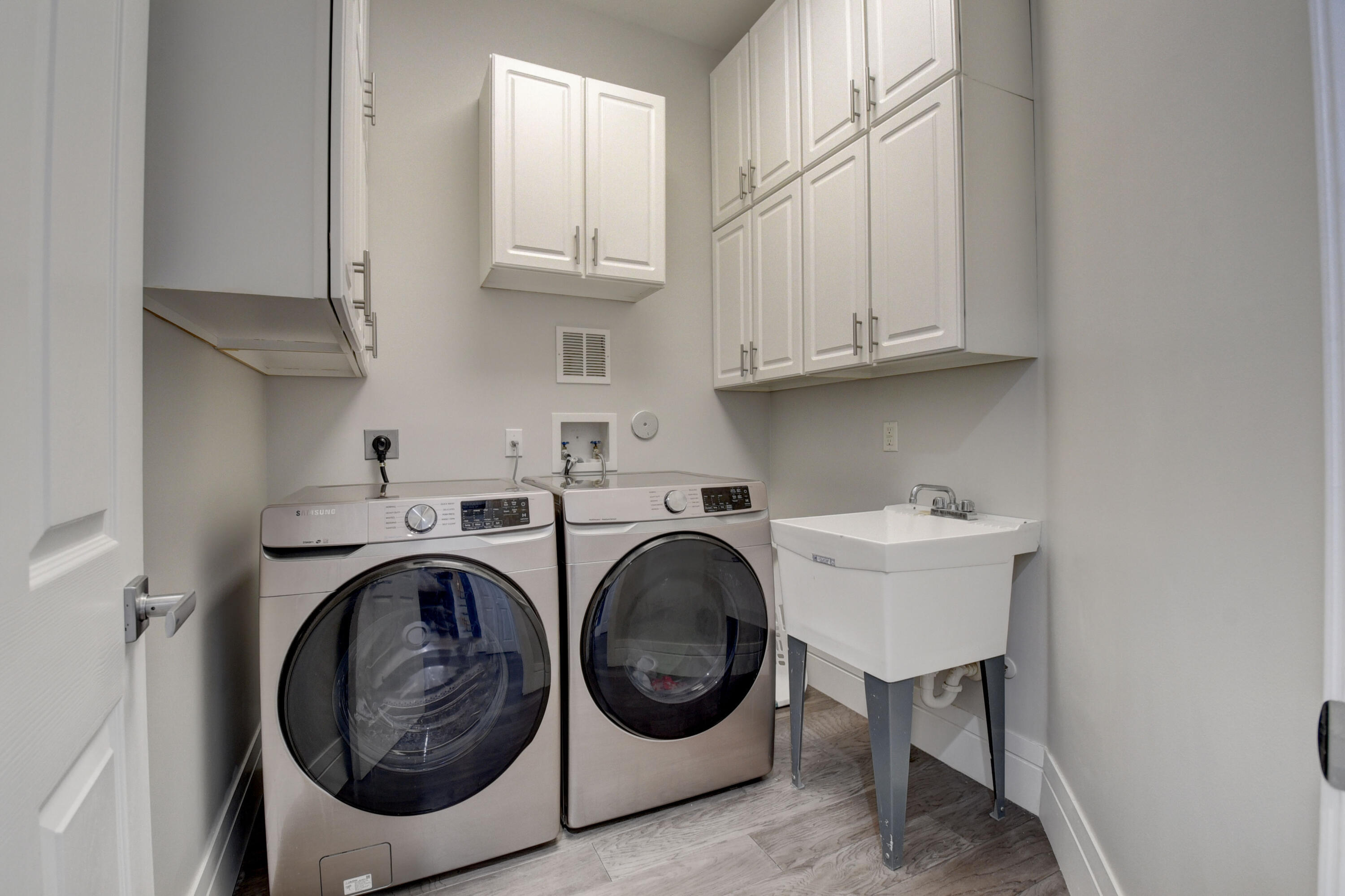 921 Osceola Drive, Unit 4 Boca Raton, FL 33432 - Photo 17 of 46 a utility room with sink dryer and washer