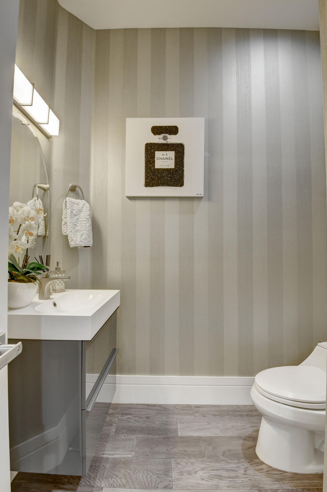 921 Osceola Drive, Unit 4 Boca Raton, FL 33432 - Photo 29 of 46 a bathroom with a sink a toilet and mirror