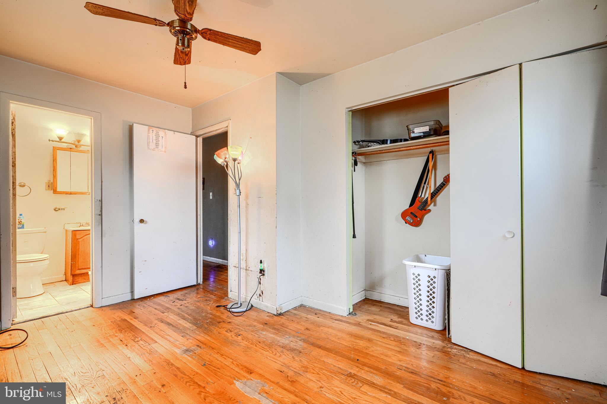6908 Drylog Street Capitol Heights, MD 20743 - Photo 13 of 38 a bedroom with a bed and wooden floor