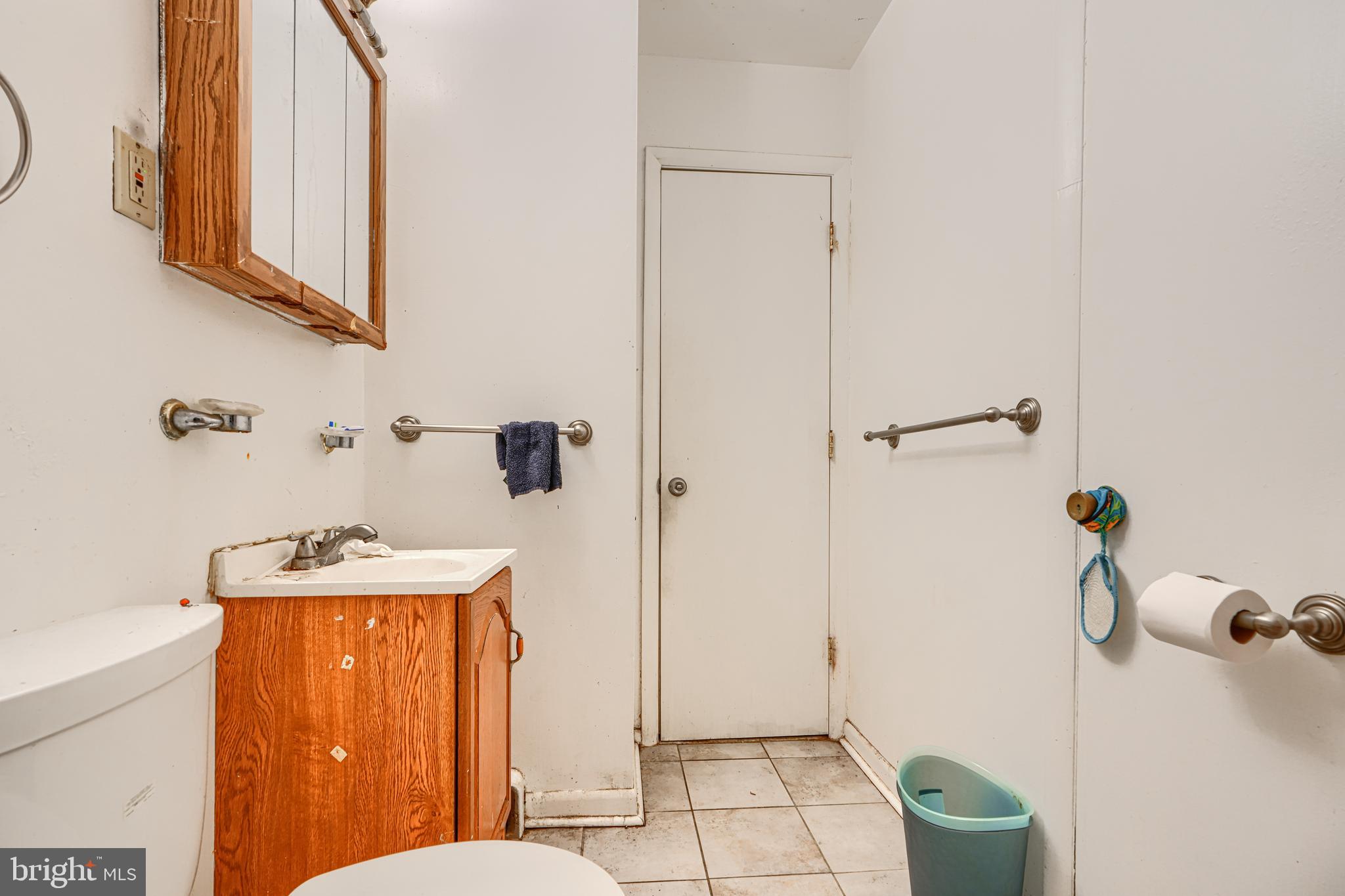 6908 Drylog Street Capitol Heights, MD 20743 - Photo 21 of 38 a bathroom with a sink toilet and shower