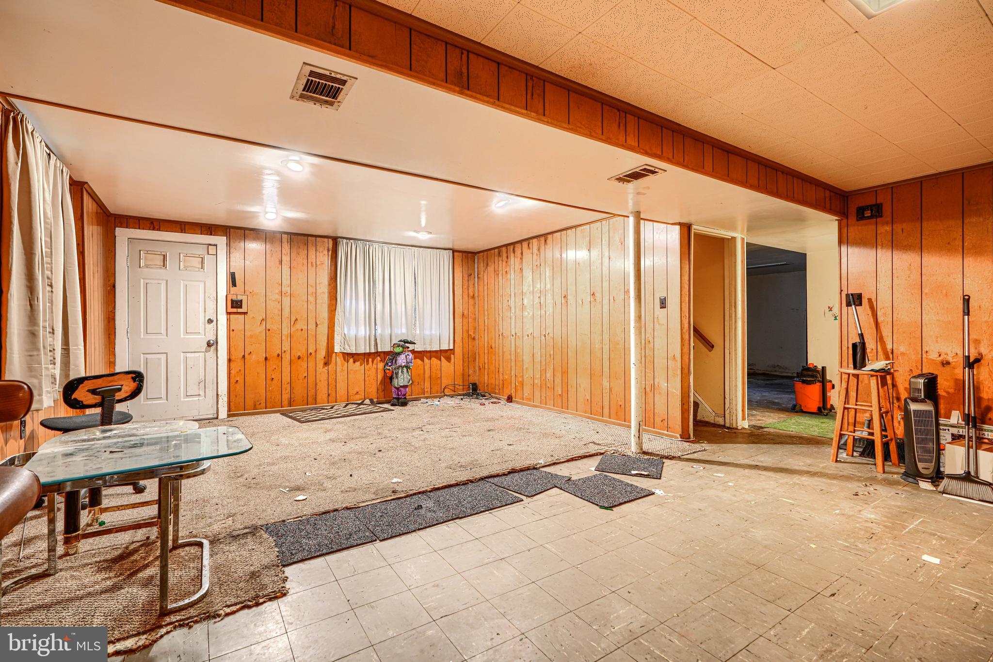 6908 Drylog Street Capitol Heights, MD 20743 - Photo 24 of 38 a living room with a large window and furniture