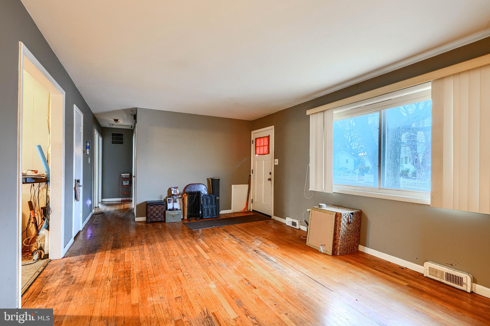 6908 Drylog Street Capitol Heights, MD 20743 - Photo 5 of 38 a view of an empty room with furniture and a window