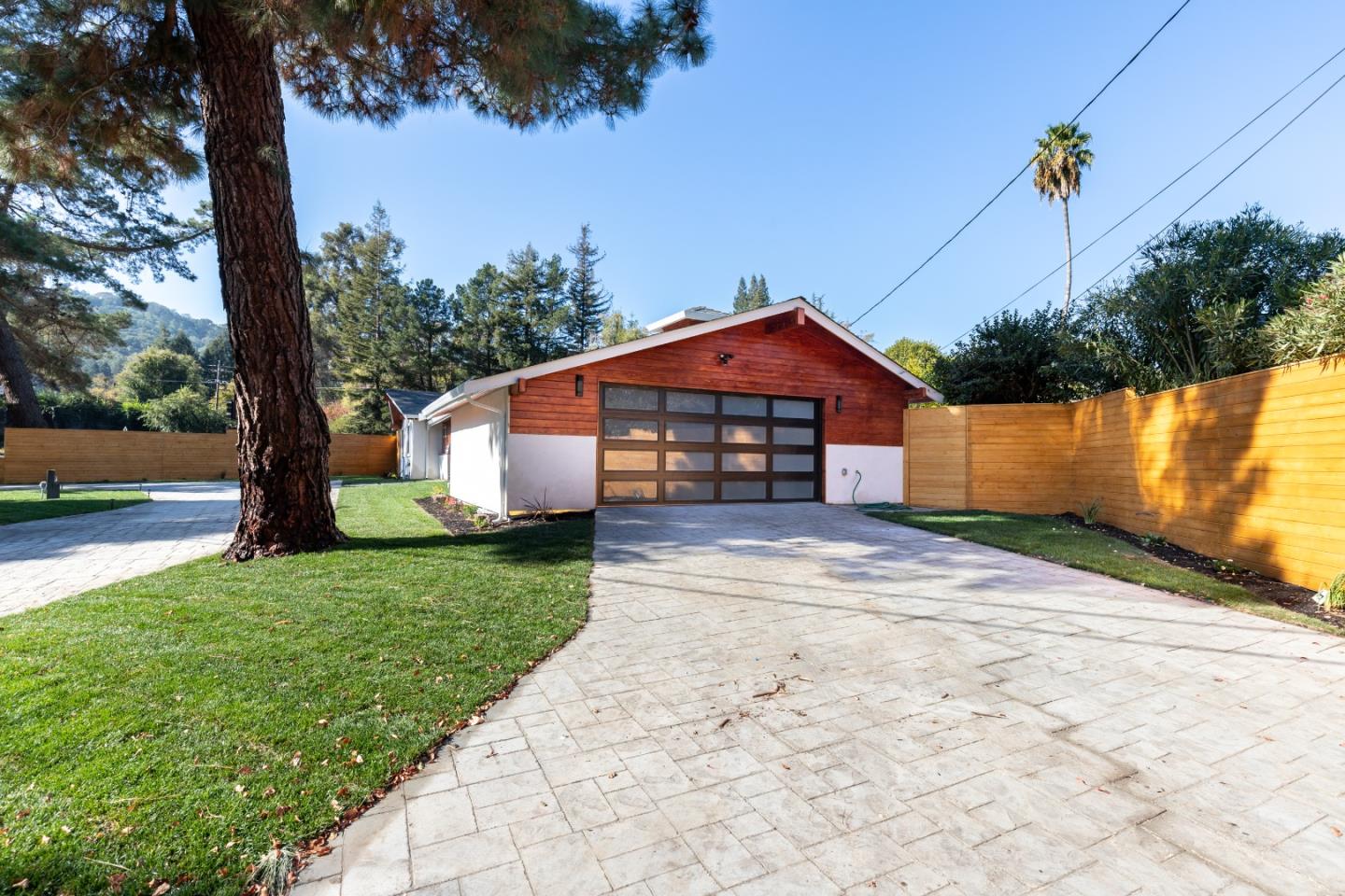 3266 Quandt Road Lafayette, CA 94549 - Photo 5 of 37 a front view of a house with a yard and garage
