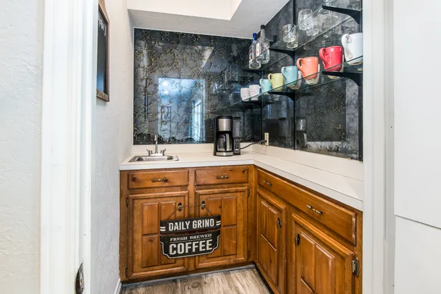 a bathroom with a sink a vanity and a mirror