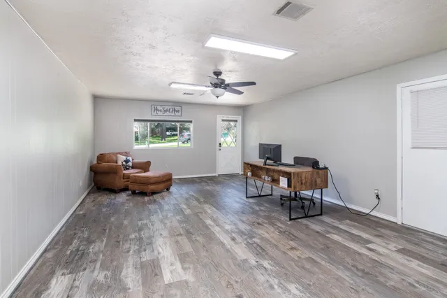 a living room with furniture and a window