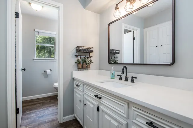 a bathroom with a sink and a mirror