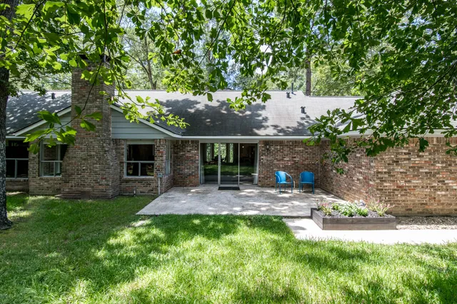 a backyard of a house with seating space