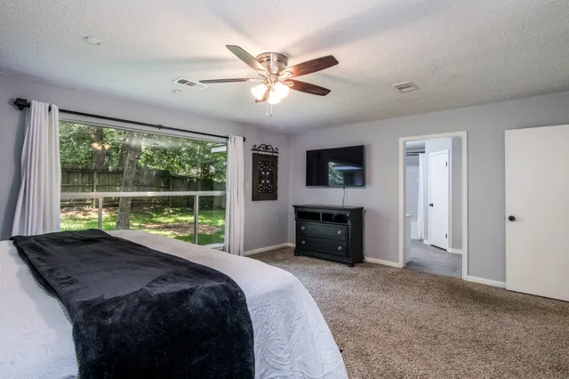 a bed room with a bed and a fireplace