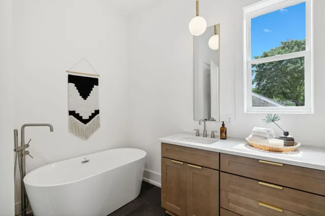 a bathroom with a sink a toilet and a bathtub