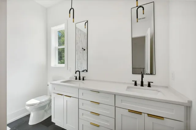 a view of a chairs and table in the balcony