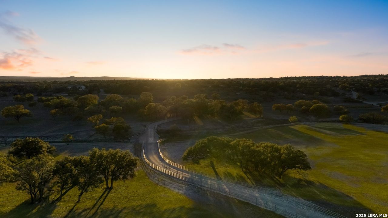 521 Bluff Creek Road North Center Point, TX 78010 - Photo 2 of 74 a view of a lake from a yard