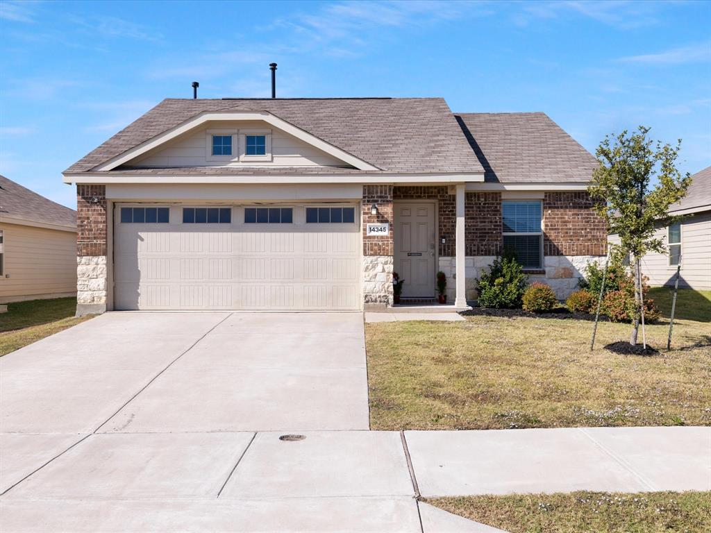 14345 Saddlebred Way Haslet, TX 76052 - Photo 1 of 1 a front view of a house with garden