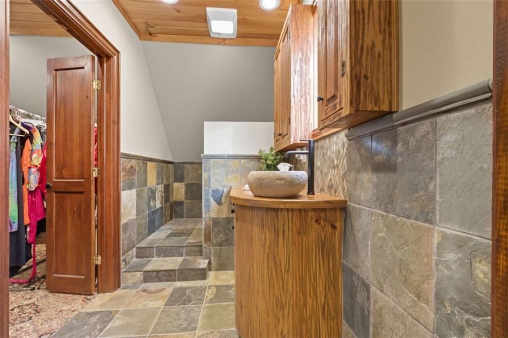 1091 Echota Road Clarkesville, GA 30523 - Photo 42 of 89 a bathroom with a sink and a mirror