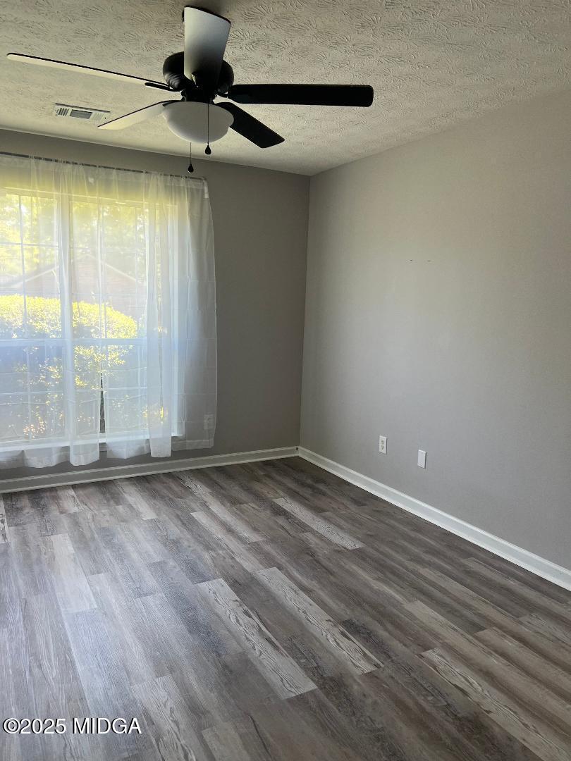 198 Apple Valley Road Macon, GA 31217 - Photo 6 of 12 a view of an empty room with a window